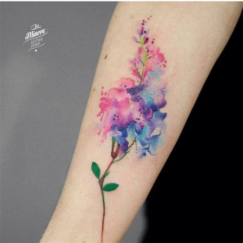 watercolor flower tattoo on inner arm | EntertainmentMesh