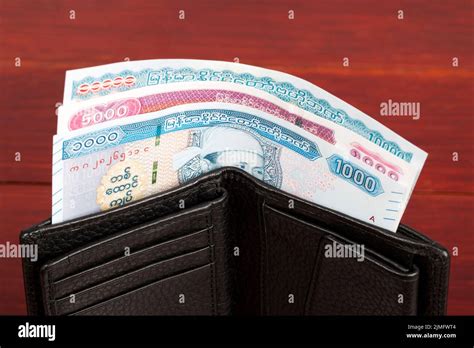 Myanmar money - kyat in the black wallet Stock Photo - Alamy