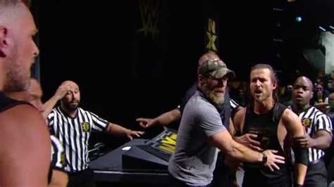 Pat McAfee Punt Kicks Adam Cole On NXT After Announce Table Confrontation