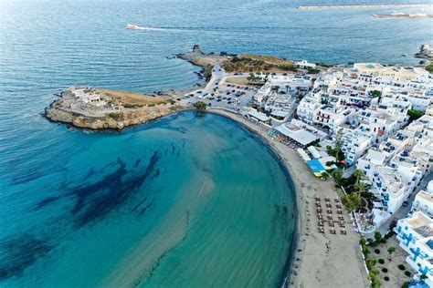 Greek islands: aerial view of the city of Naxos (Chora), its port and the beach of Agios ...