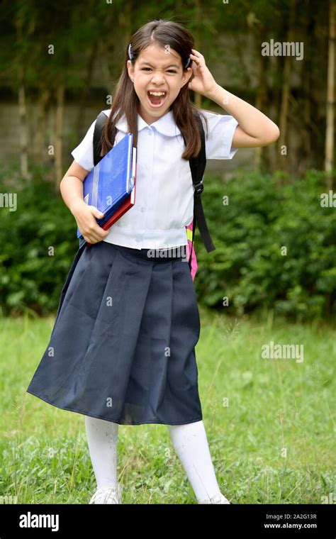 Young Filipina School Girl And Anxiety Wearing School Uniform Stock Photo - Alamy