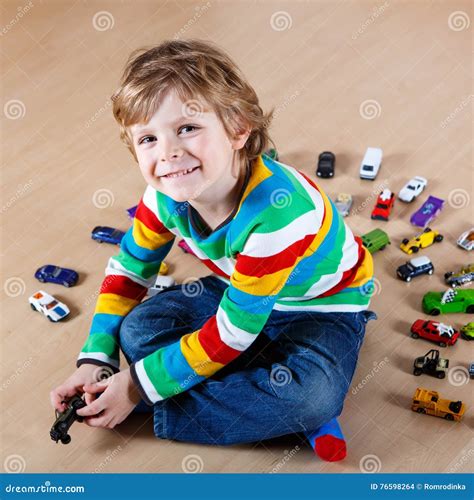 Little Blond Child Playing with Lots of Toy Cars Indoor Stock Photo - Image of person, daycare ...