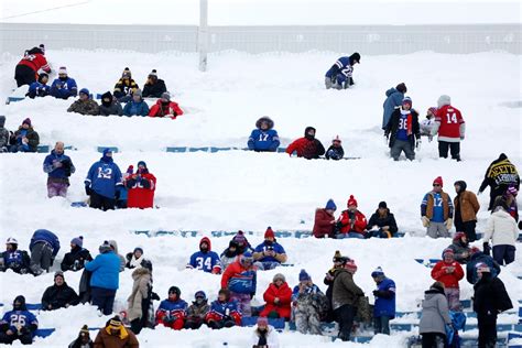 Buffalo Bills fans work hard and play hard while shovelling snow at ...