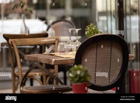 interior design, wooden table with antique chairs and glasses, vintage ...