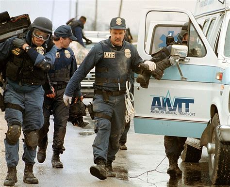 ATF Agents help one of their wounded into an ambulance during the Waco siege, 1993. [1200 x 979 ...