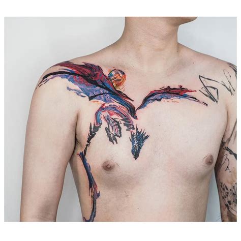 Watercolor style dragon tattoo located on the chest.