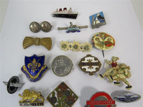 Selection of vintage enamel badges etc.