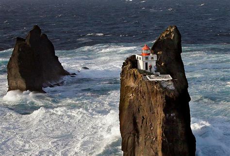 Incredible location for a lighthouse perched on a rock in Iceland's ...