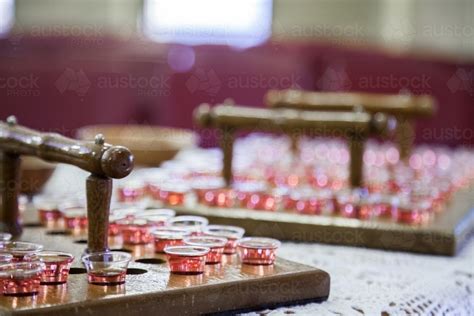 Image of Communion cups of juice in trays and bread for a church service - Austockphoto