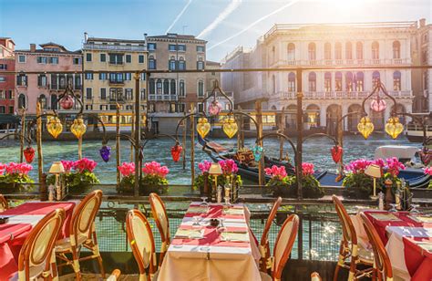 Restaurant Tables Near The Canal Of Venice Italy Stock Photo - Download ...