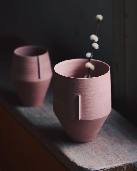 Two bone dry pots, simple vessels thrown with a high irons stoneware ...