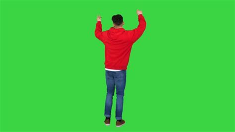 Casual Man Dancing in a Red Hoody on a Green Screen, Chroma Key, Stock ...