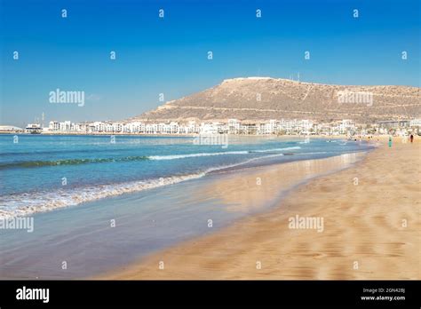 Beach and yellow sand on the coastline of Agadir in the summer season ...