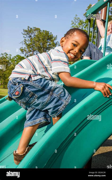 Alabama dothan playground child children black boy climbing slide hi ...