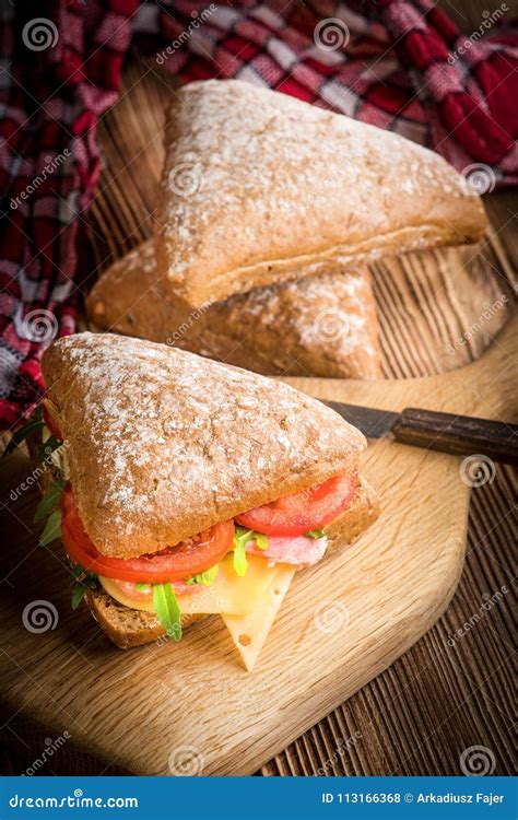 Triangular Sandwich with Cheese, Ham and Tomato. Stock Photo - Image of cutting, brunch: 113166368