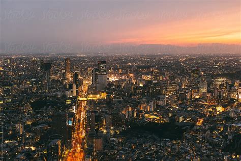 "Tokyo Skyline At Sunset." by Stocksy Contributor "BONNINSTUDIO " - Stocksy