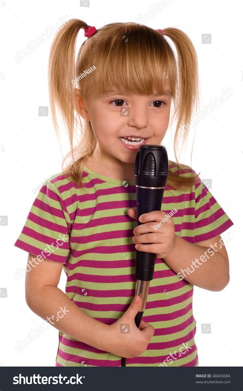 Child Singing With A Microphone. Funny Little Girl Isolated On White ...