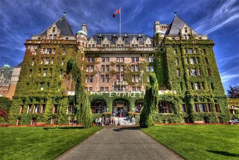 an old building with ivy growing all over it's sides and the entrance way