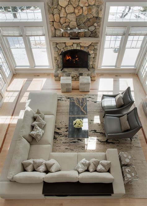 A dramatic floor to ceiling stone fireplace is the focal point in this ...