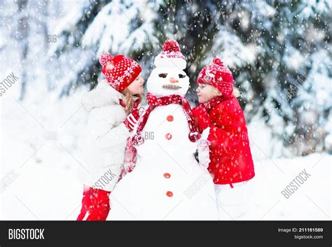 Kids Building Snowman Image & Photo (Free Trial) | Bigstock