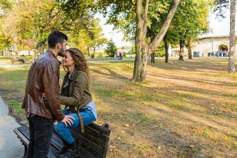 Sweet couple on park bench Stock Photo free download