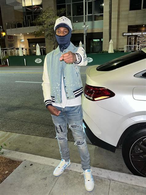 Lil TJay Poses In Full Blue and White Amiri Outfit | INC STYLE