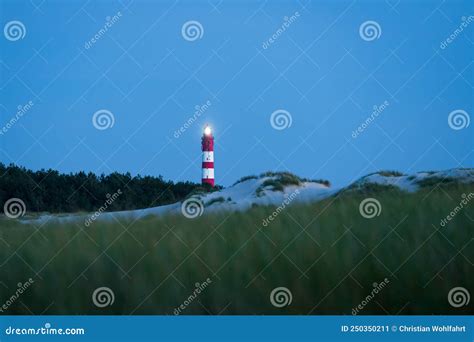 Lighted Lighthouse on the Dunes of Amrum Island Germany with Clear Blue ...