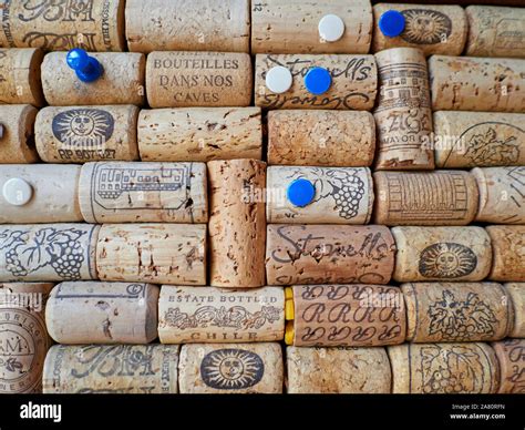 A cork board made out of old wine bottle corks in a wooden frame with wihite and blue pins Stock ...