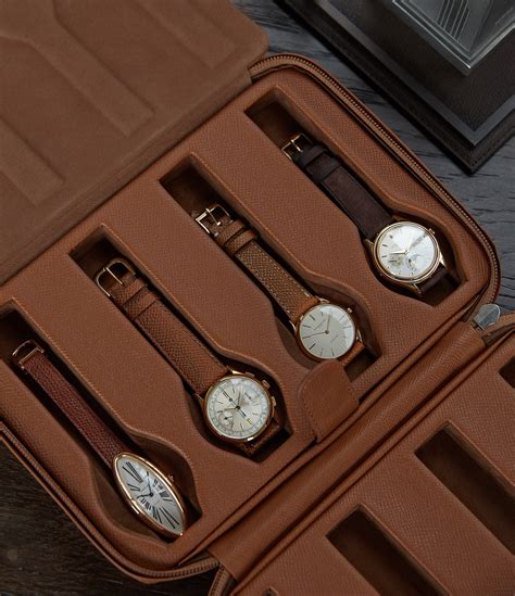 This watch case can hold up to eight watches. Produced using a firm external frame and grained ...