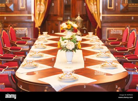 Dining room of medieval castle in Belarus. Old beatiful red chairs and ...