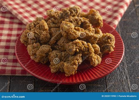 Fried and Crispy Chicken Gizzards on a Dark Wooden Table Stock Photo - Image of bite, meal ...