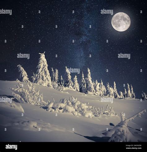 Full moon in night sky in the winter mountains Stock Photo - Alamy