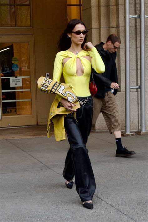 Bella Hadid Elevates Edgy Yellow Cutout Top With Pointy Pumps ...