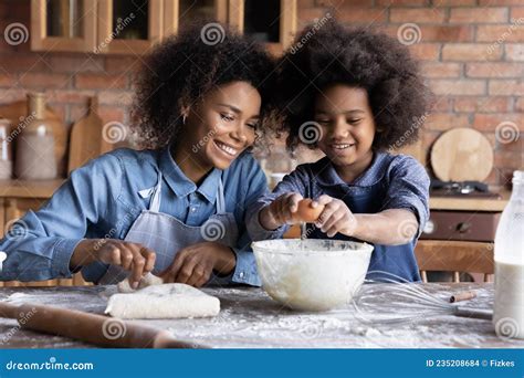 Happy African American Family Cooking in Kitchen. Stock Photo - Image of dessert, biscuit: 235208684