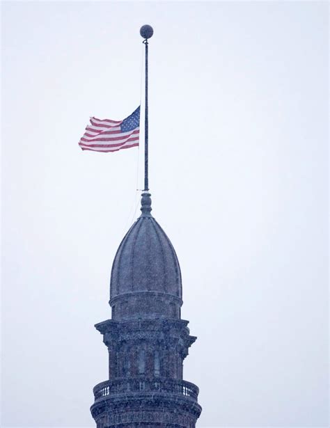 Why are flags flying at half-staff in Wisconsin today?