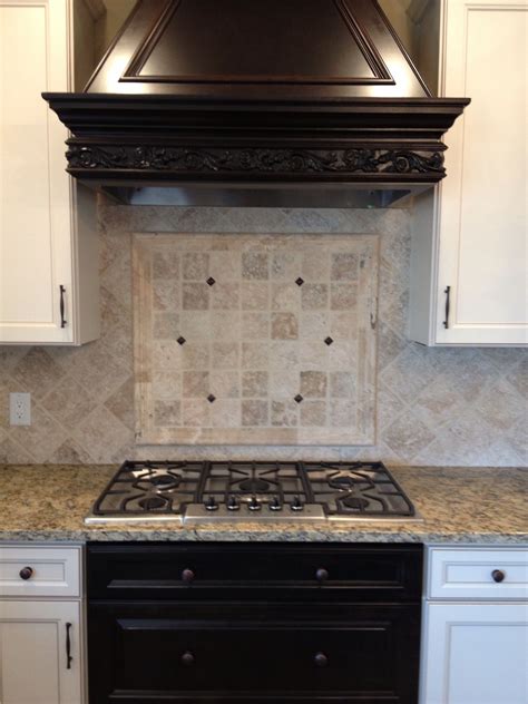 Tumbled limestone tiles were used to create a classic design backsplash...by Transformed ...