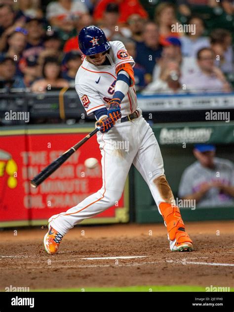 Houston Astros shortstop Mauricio Dubon (14) hits an RBI single to left field in the bottom of ...