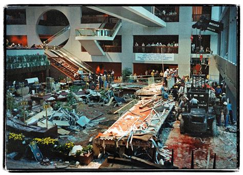 Workers cleaning up after the 1981 Hyatt Regency walkway collapse, a ...