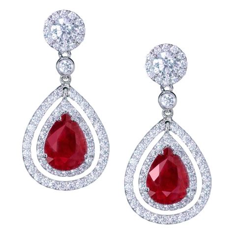 Pear Shape Ruby and Diamond Double Halo Dangle Earrings For Sale at 1stdibs