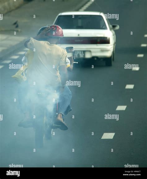 Pollution, exhaust fumes, street scene, moped driver, Mauritius, air ...