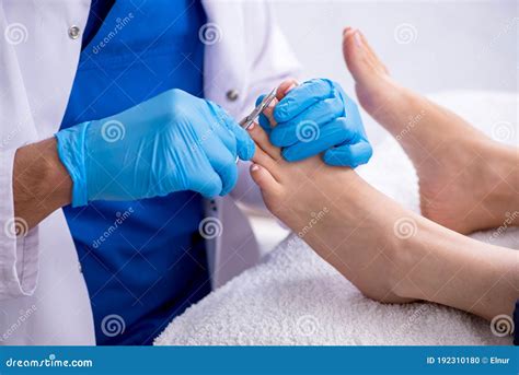 Podiatrist Treating Feet during Procedure Stock Photo - Image of fungus ...