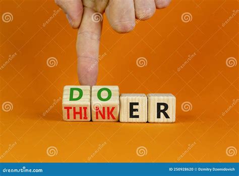 Doer or Thinker Symbol. Concept Words Doer or Thinker on Wooden Cubes. Businessman Hand Stock ...