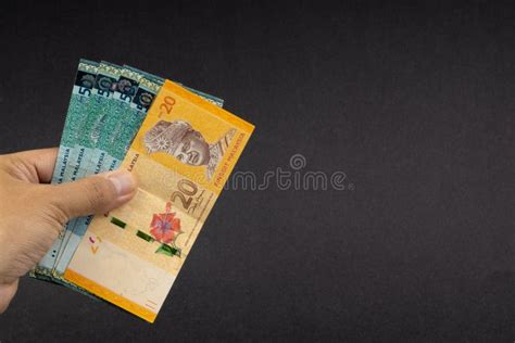 Hand Holding Malaysia Ringgit MYR Currency Bank Notes. Stock Photo - Image of exchange ...