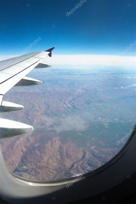 Beautiful view from plane window Stock Photo by ©luckybusiness 87140978