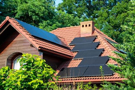 Premium AI Image | Solar power energy on the roof to a standard house