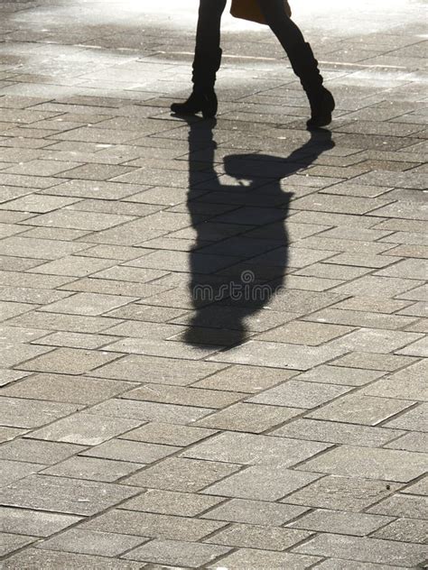 Shadow of man walking stock photo. Image of white, female - 264705282