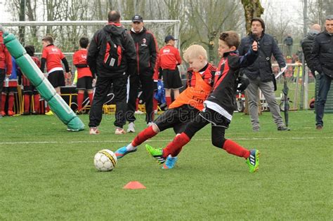 Kids` Soccer, Children Play Ball in Football School Editorial Stock ...