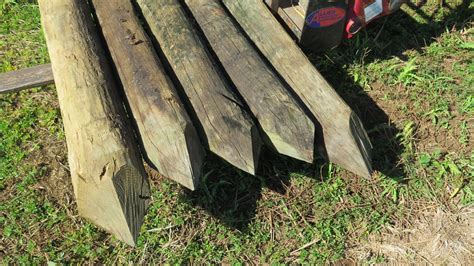 Qty 20 "Large" Pointed Wooden Fence Posts (8' L, 8" to 9" Dia.) - Oahu Auctions