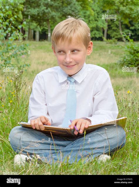 Boy with a sly look on his face Stock Photo, Royalty Free Image ...