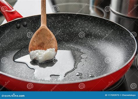 Wooden Spoon with Coconut Oil in Frying Pan. Stock Image - Image of ...